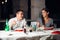 Smiling woman on a date in a restaurant,having a conversation over a meal in hotel.