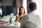 Smiling woman on a date in a restaurant,having a conversation over a meal in hotel.Positive emotions,love,affection