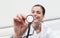 Smiling woman doctor with stethoscope touch screen close up, diagnosis and treatment concept