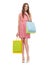 Smiling woman in dress with many shopping bags