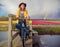 Smiling woman in Dutch countryside.