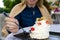 Smiling woman eat Beautiful pavlova cakes with strawberries and spoon in restaurant.