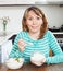 Smiling woman eating boiled rice