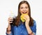 Smiling woman eating burger. White back