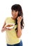 Smiling woman eating cereal breakfast