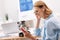 Smiling woman enjoying music in the office