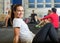 Smiling Woman Exercising In Cross Training Box