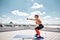 Smiling woman is exercising with outfit on high terrace