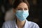 Smiling woman in facial mask protect from covid-19