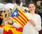 Smiling woman with Flag of Catalonia