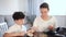 Smiling woman giving pocket money to her preteen son at home