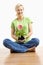 Smiling woman holding gerber daisy.