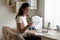 Smiling woman holding paper, reading good news in letter