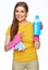 Smiling woman housewife pointing finger on cleaner bottle.