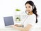 Smiling woman with laptop and headphone