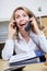 Smiling woman making calls with two