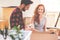 Smiling woman and man packing stuff during relocation to new home