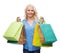 Smiling woman with many shopping bags