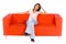 Smiling Woman On Orange Couch