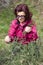 Smiling woman picking wild asparagus