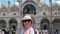 Smiling woman with a pigeon perched her head  St Mark\\\'s Square in Venice  Italy