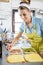 Smiling woman preparing sandwich