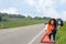 Smiling woman putting out a traffic warning sign