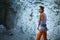 Smiling woman rock climber belayer with the rope