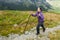 Smiling woman rocky mountain hiking