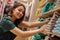 A smiling woman shopping in retail store.