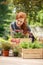 Smiling woman smelling pink flowers