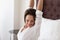Smiling woman stretching on bed enjoying waking up happy concept