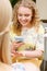 Smiling woman taking picture of her wedding ring