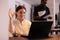 Smiling woman talking on videoconference, greeting colleague on videocall