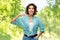 Smiling woman with toothpaste on wooden toothbrush