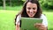 Smiling woman touching a tablet computer