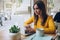 Smiling woman watching video on computer working on freelance