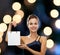 Smiling woman with white blank shopping bag