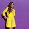 Smiling Woman In Yellow Mini Dress Looking Away