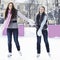 Smiling women on ice rink