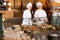 Smiling women selling fresh pastry and loaves