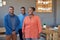 Smiling young African coworkers standing together in an office