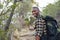 Smiling young African man hiking in the hills