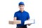 Smiling young asian salesman with parcel and clipboard against a