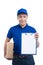 Smiling young asian salesman with parcel and clipboard against a