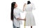 Smiling young asian tailor measuring stylish white dress on dummy