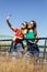 Smiling young best female friends taking selfie in the park