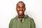 Smiling young black man with windbreaker against isolated white background