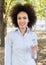 Smiling Young Black Woman Hold Bottle Of Water In Nature