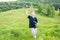 Smiling young boy preparing to launch RC plane. Beautiful nature background.